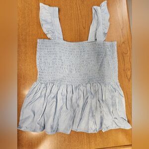 💕NWOT Freshman Large blue flowing top. It has a smocked bodice and a swingy pep
